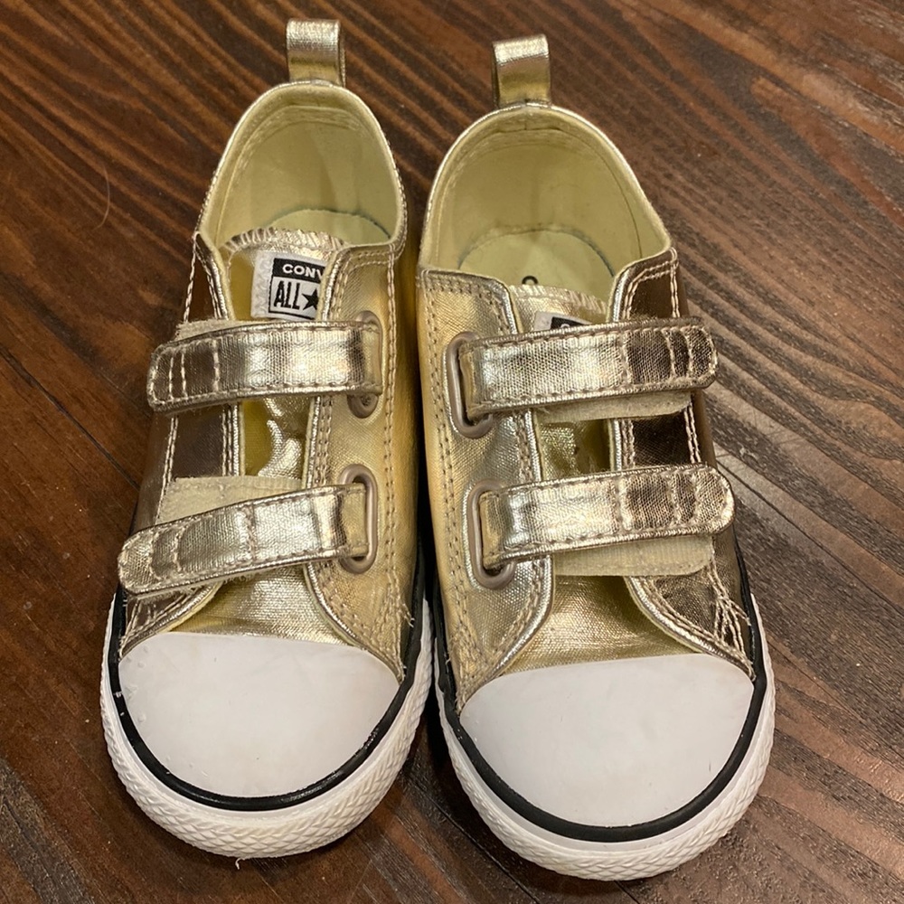 Gently used toddler sized gold converse Velcro strap